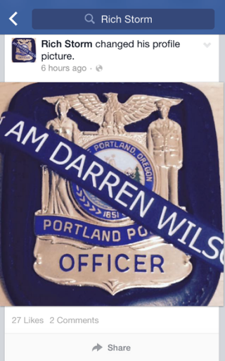 Illustration for article titled Cop Who Hugged Crying Kid in Viral Photo Allegedly Supported Darren Wilson